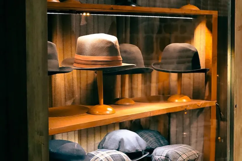 Top hats behind a glass window