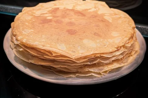 Stacked crepes on a plate