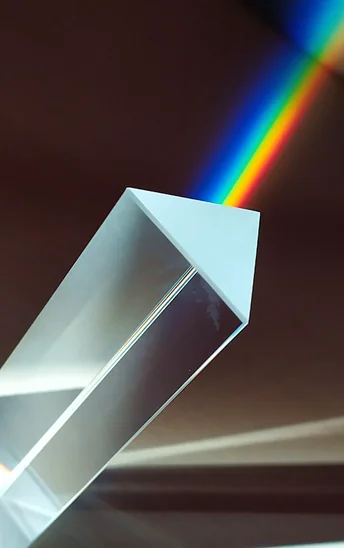 Light refracting off a prism from white to rainbow colors